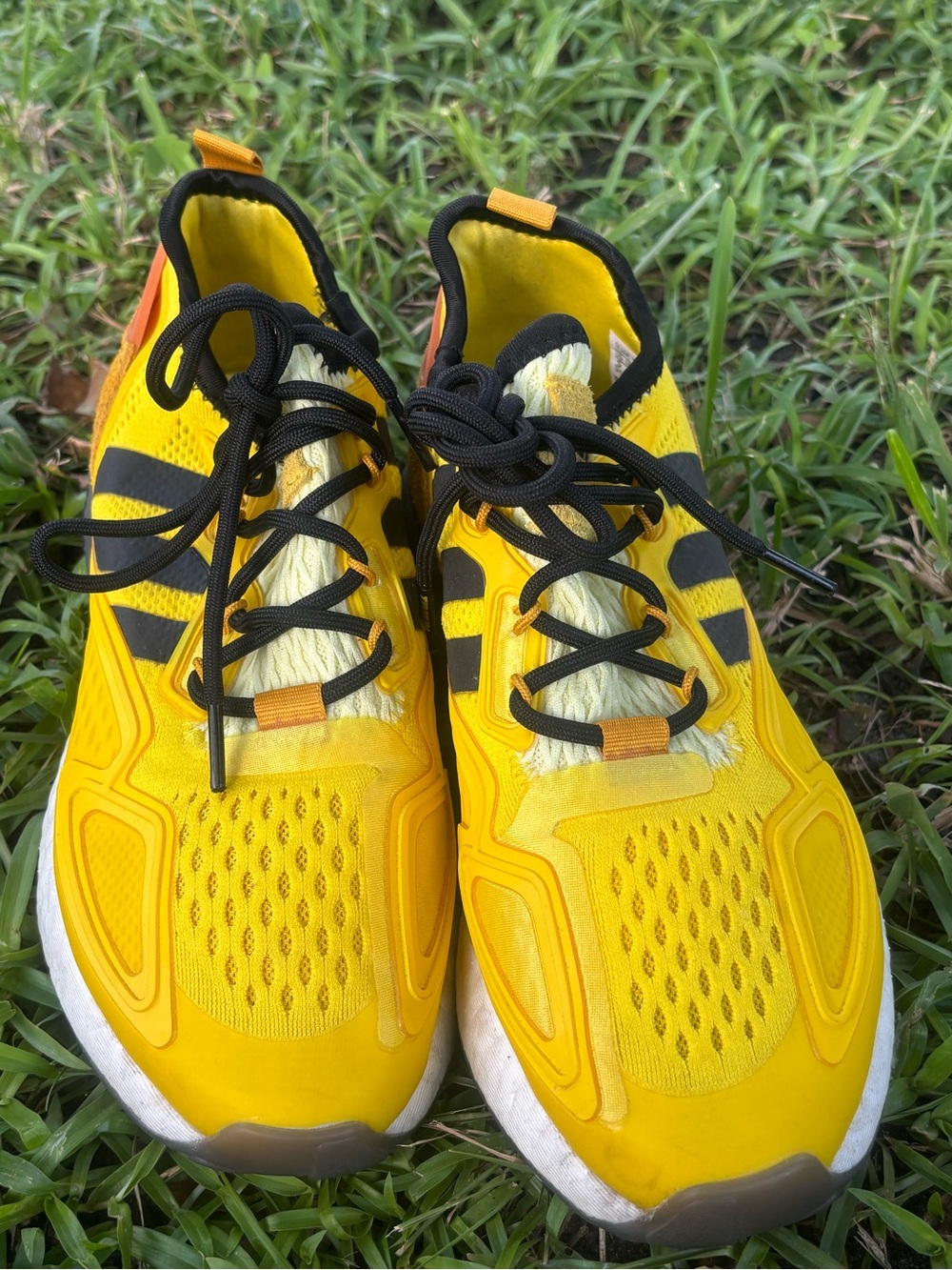 Vibrant yellow Size 5 Adidas ZX 2K Boost Ninja 'Time In' sneakers.